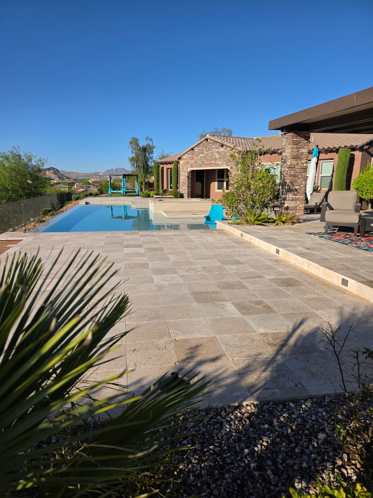 Las Vegas backyard with a pool, protected by monthly pest service